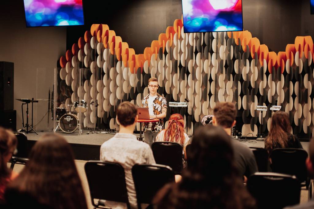 This is an image of Billy serving in church as a leader in our student ministries