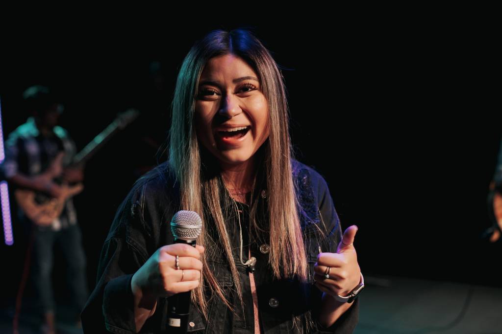 An image of Kayla serving in church on our worship dream team